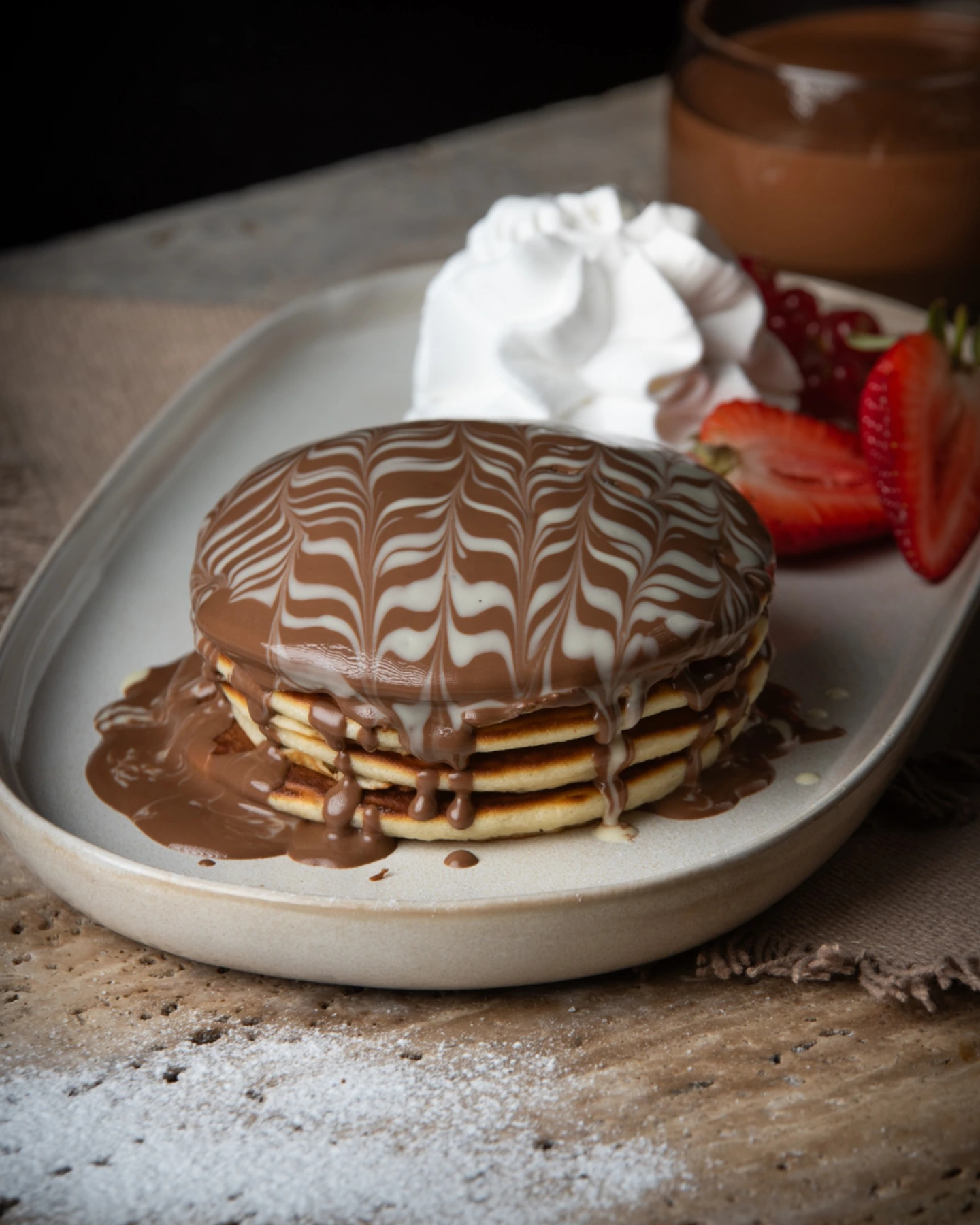 Chocolate pancakes with cream