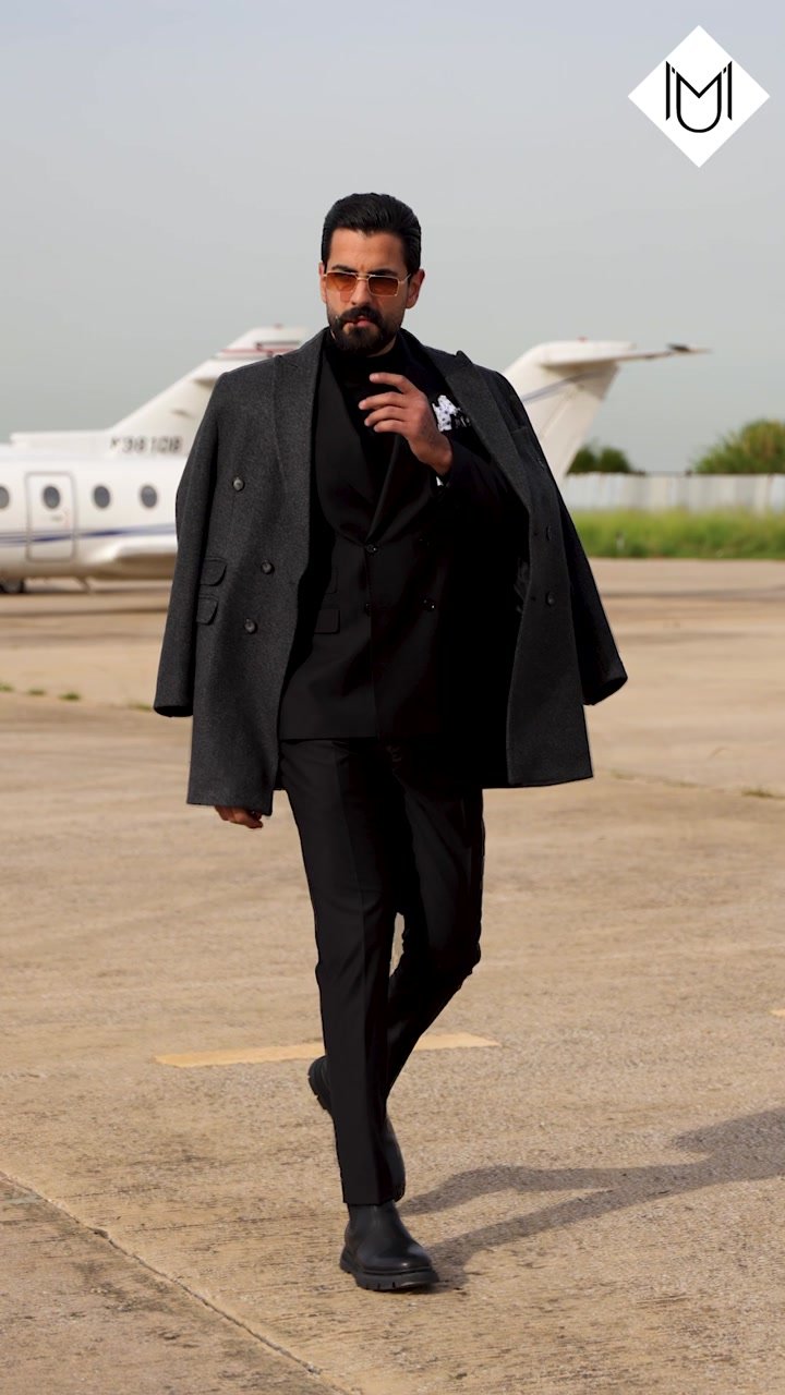 Black suit on an airfield