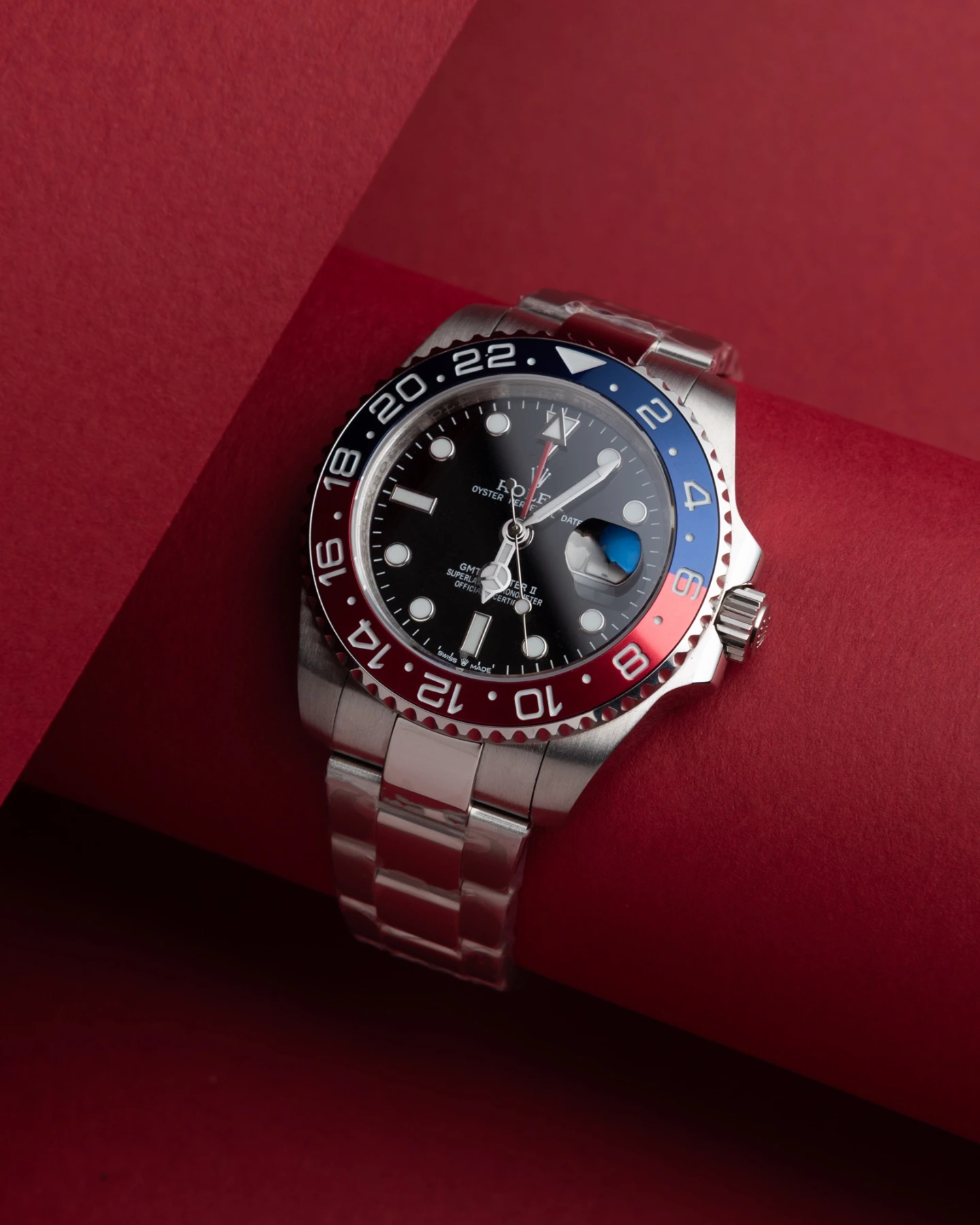 Watch styled on a red background