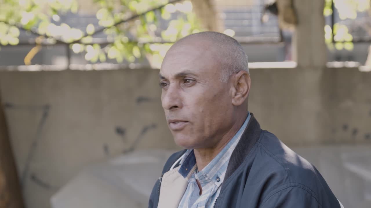 A man speaking in Under a Spell